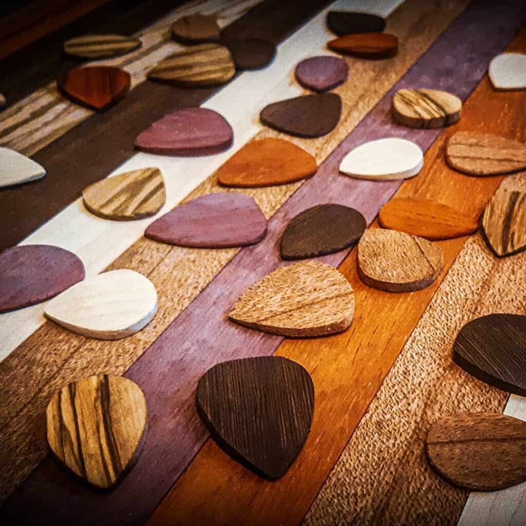 a selection of wooden guitar picks by terratone