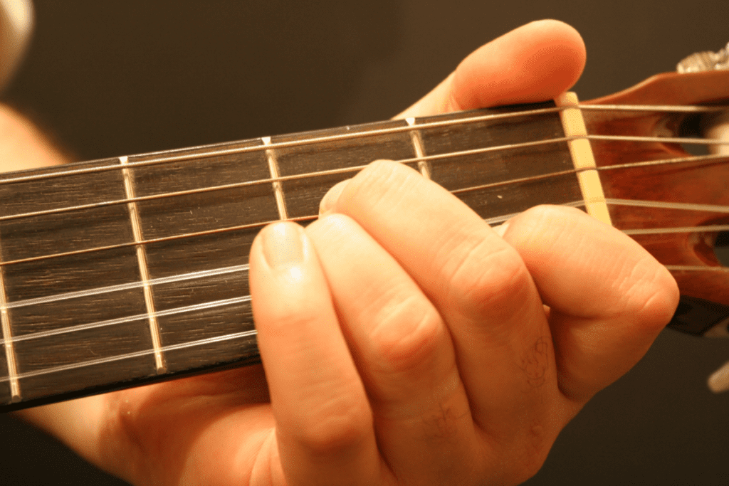Arching your fingers is crucial for getting a clean sound out of your first basic guitar notes