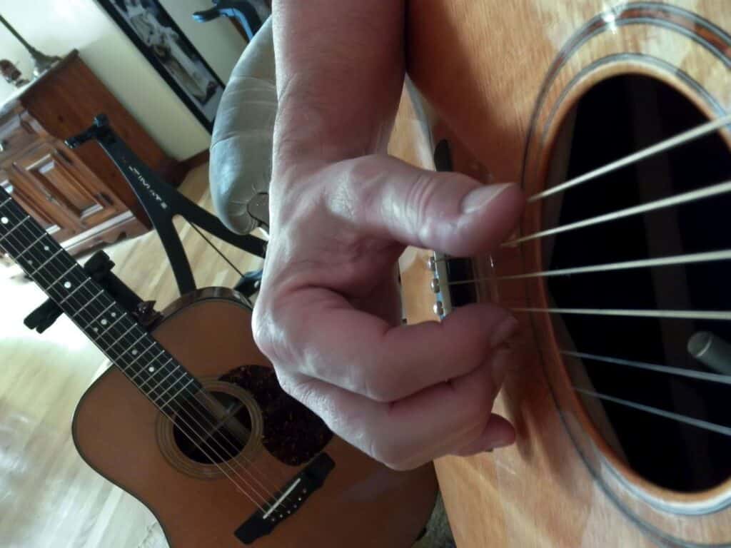 Fingerpicking acoustic guitar