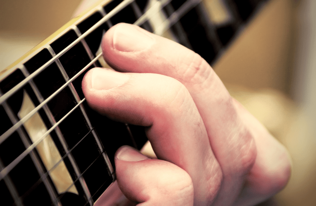 how to place your fingers to improve your guitar tone