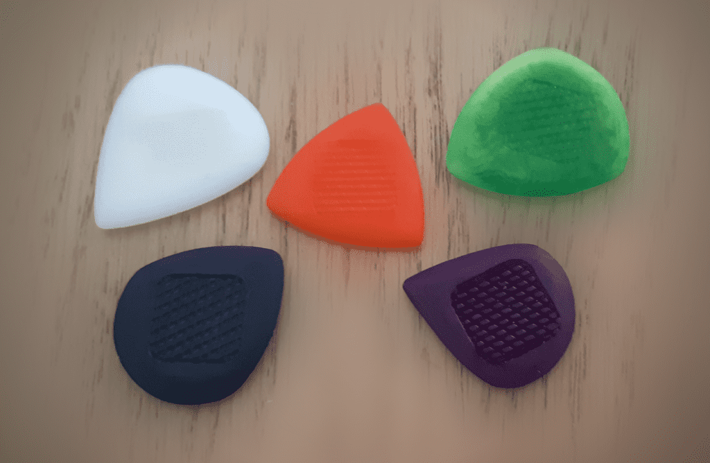guitar picks made of tagua nut by howling monkey picks