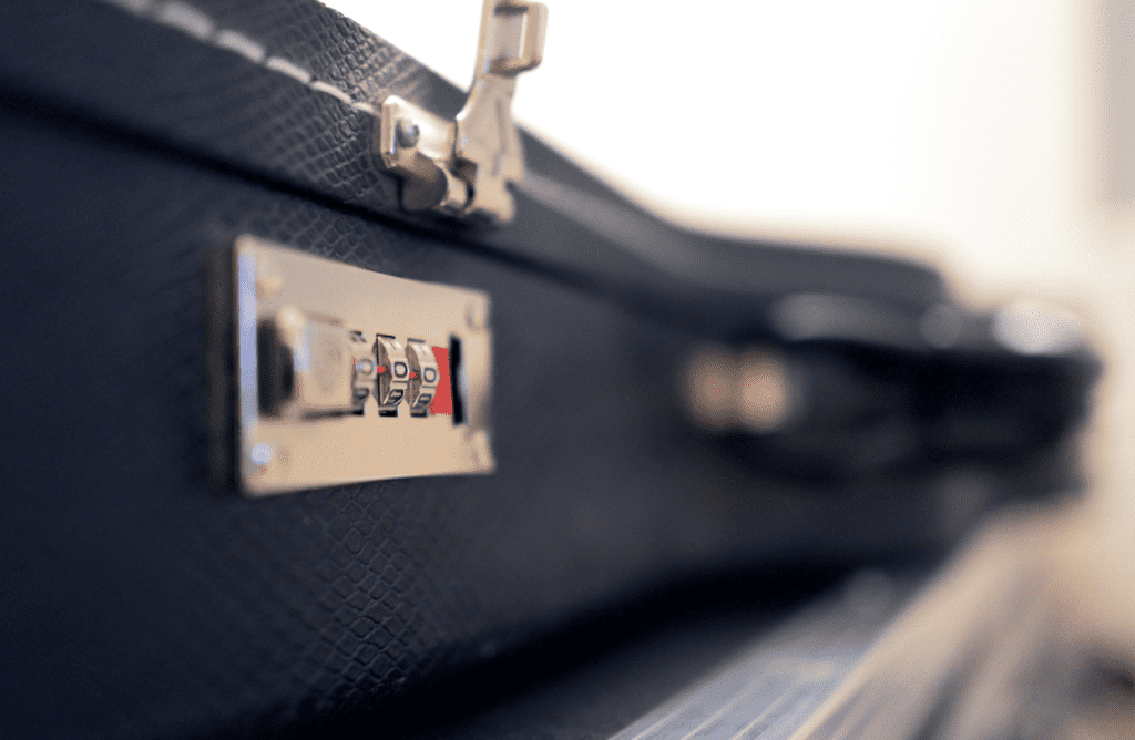 A locking hardshell guitar case is the most important thing you can have when traveling with a guitar