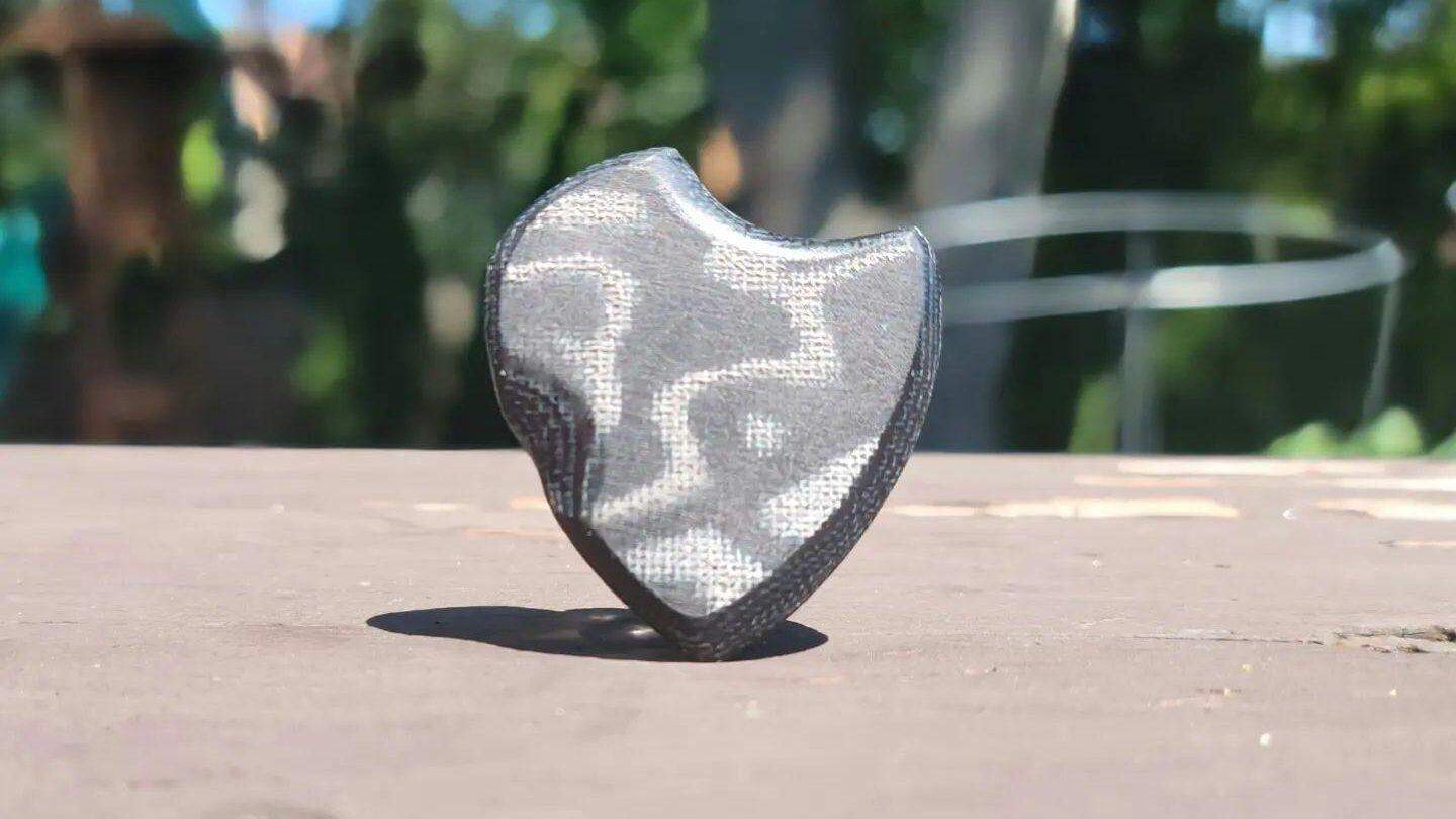 Micarta guitar pick made by GT Plectrum, featuring one of their original designs - Africa