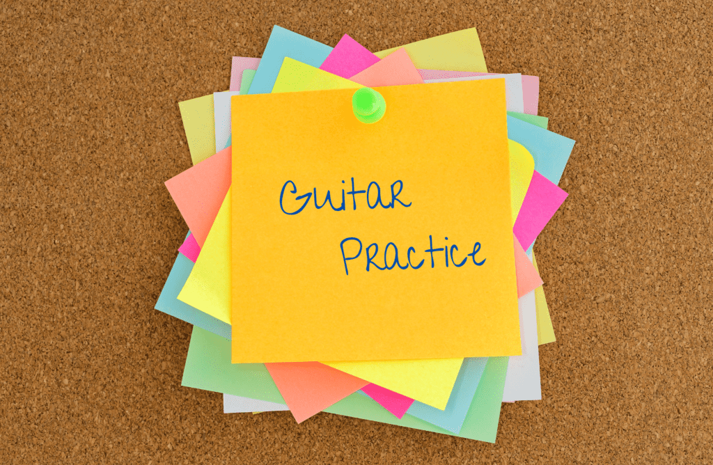 a post-it reminder to practice guitar