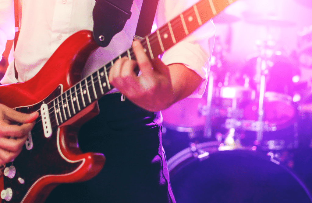 a guitar player plays in a teenage band