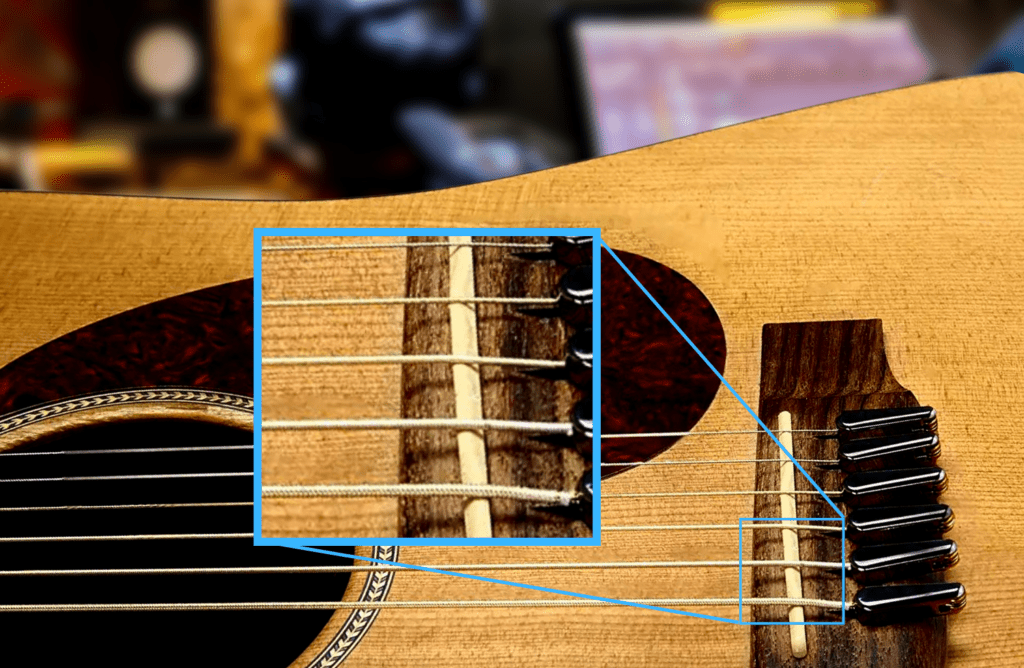 The angle at which the power pins make the strings approach the bridge saddle is too narrow