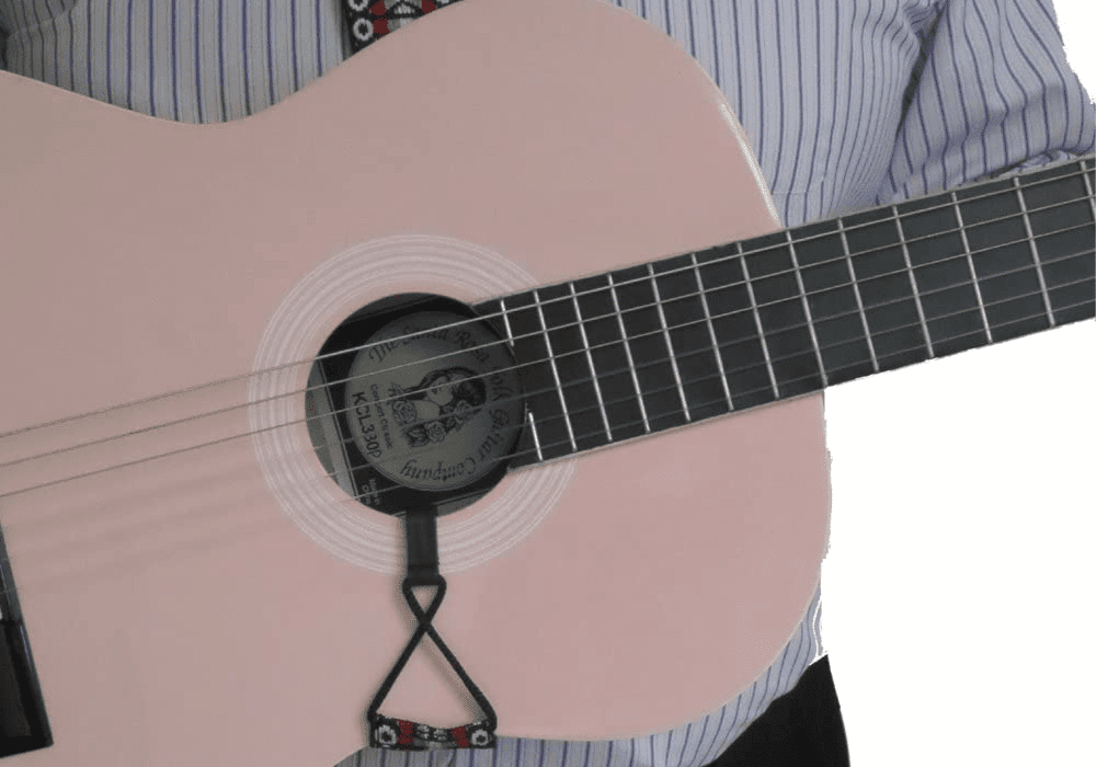 A classical guitar held with a strap