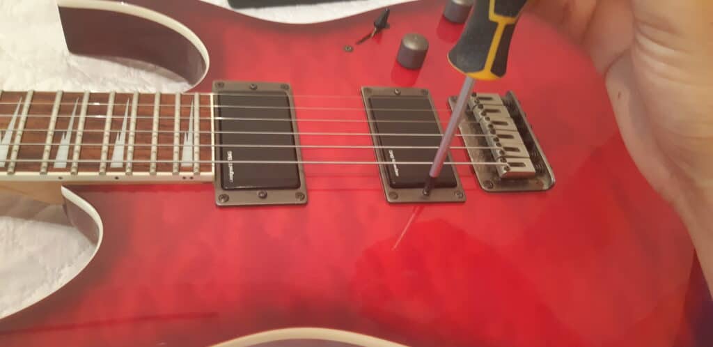 Adjusting the height of the pickups during a guitar setup