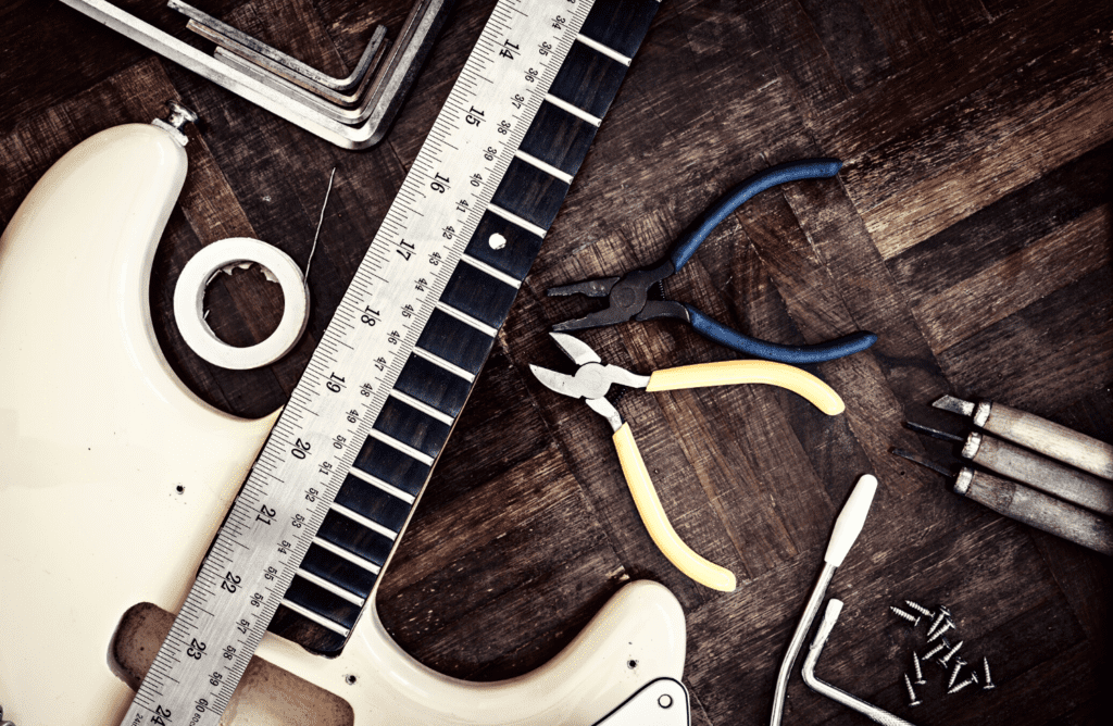 The desk of a guitar luthier preparing to set up a guitar