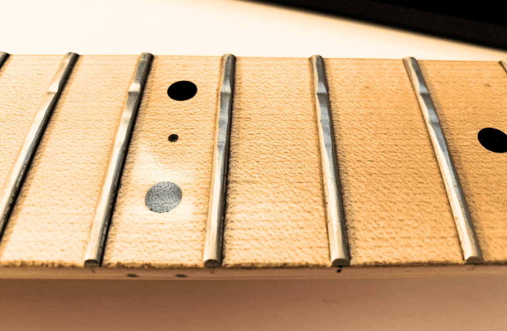 worn out guitar frets