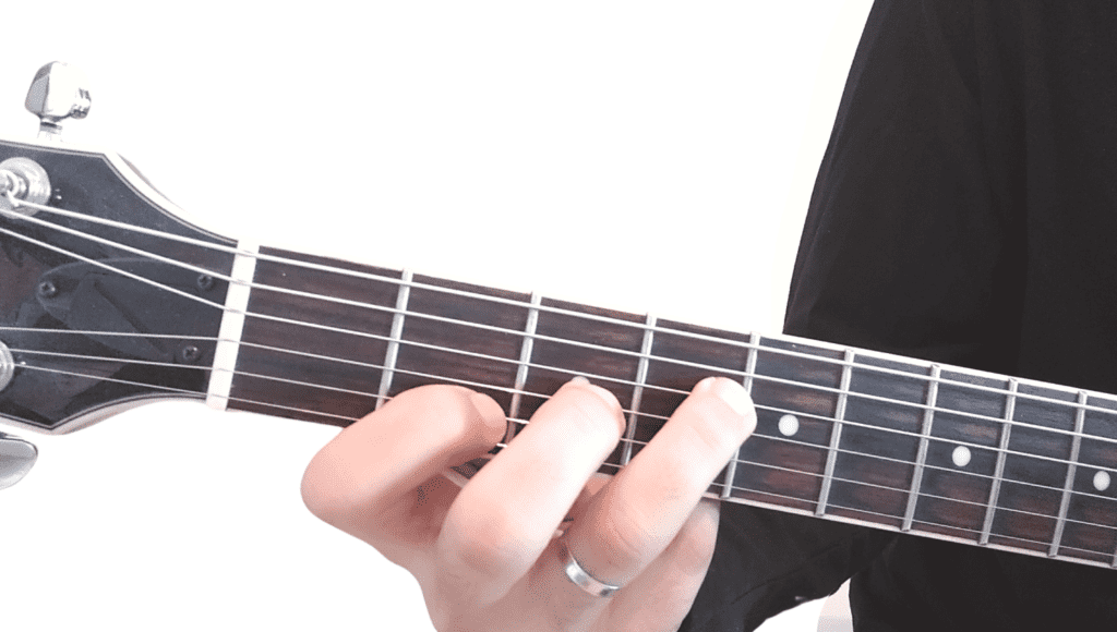 Fingering of a F#7 Chord played on a guitar