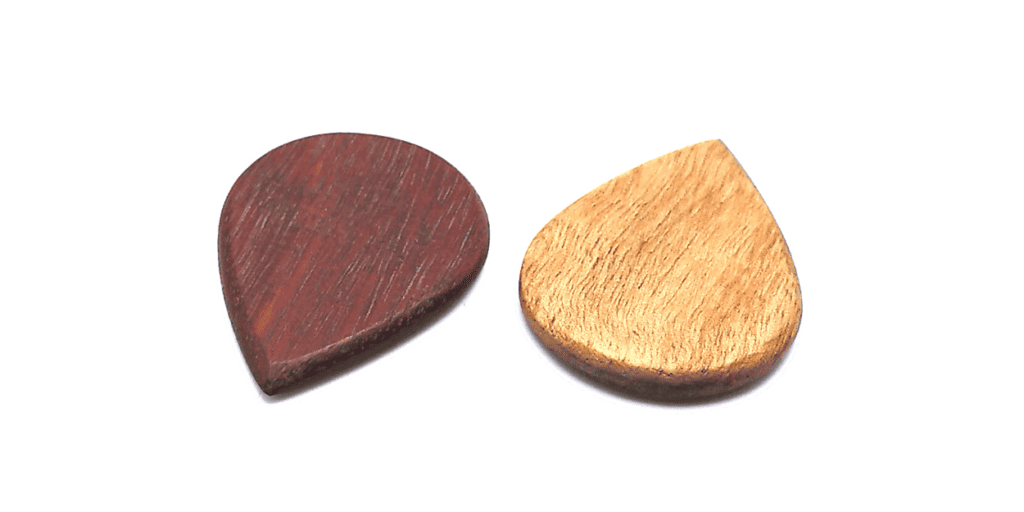 Wooden guitar picks made by Plumstone Guitar Picks_ Jarrah (left) and Mountain Ash (right)